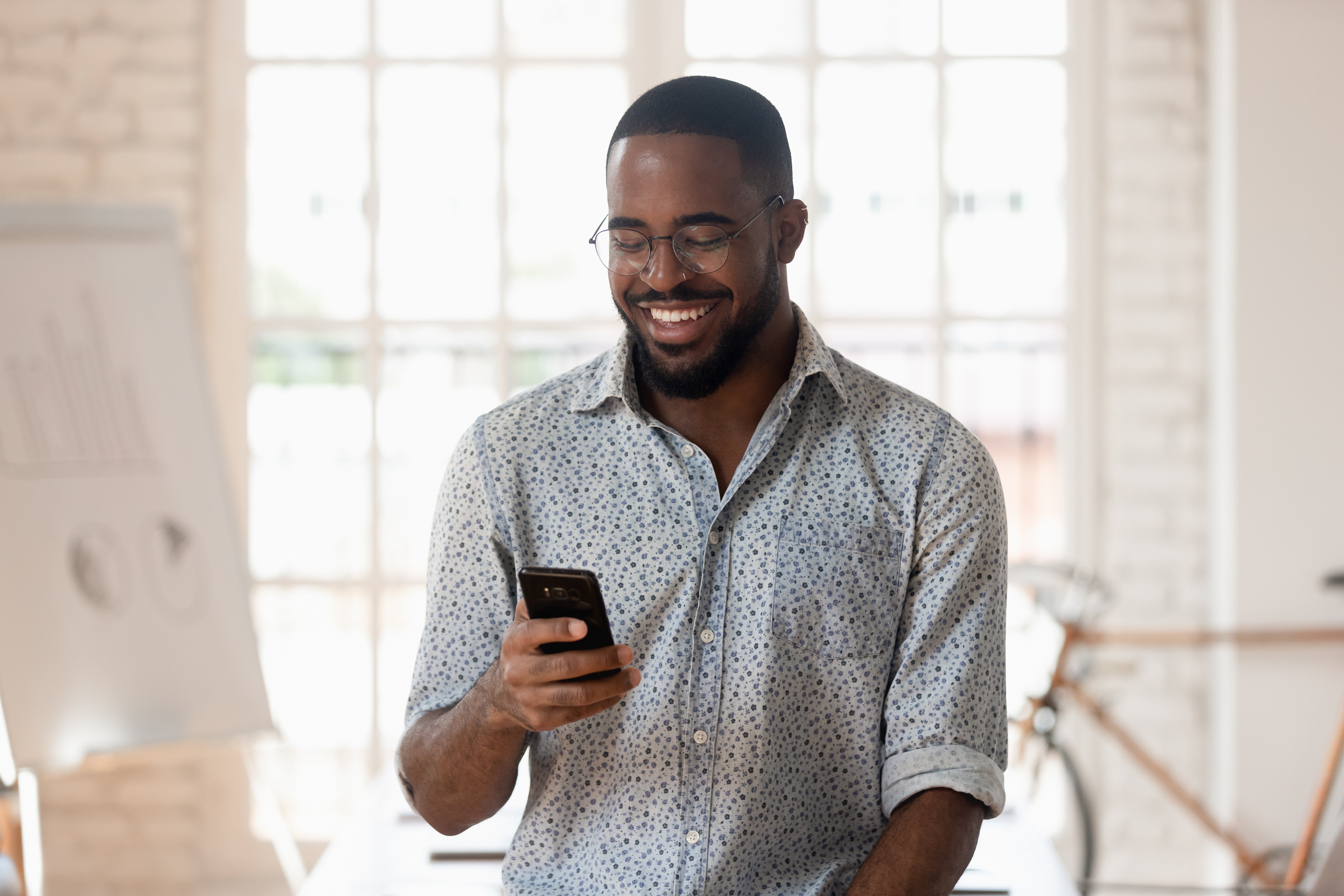 happy black man on phone